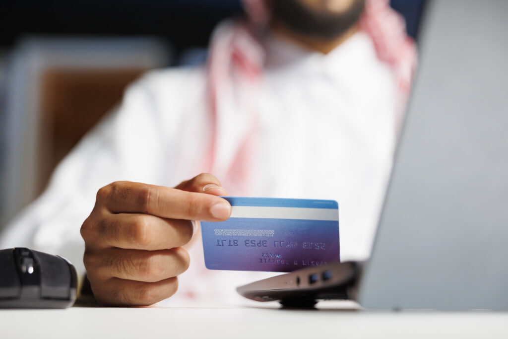 arab businessman shops with credit card